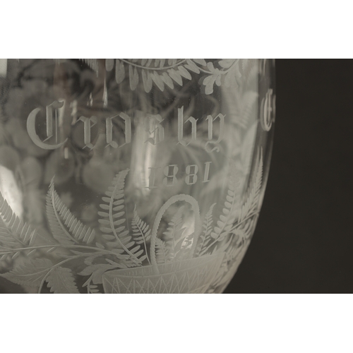 5 - AN OVERSIZED LATE 19TH CENTURY ENGRAVED GLASS COIN GOBLET the body having floral decoration and insc... 