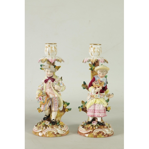 55 - A PAIR OF 19TH CENTURY JOHN BEVINGTON FLORALLY ENCRUSTED FIGURAL CANDLESTICKS finely detailed and de... 