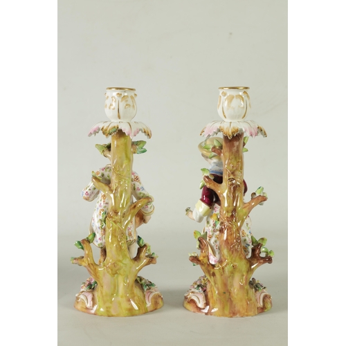 55 - A PAIR OF 19TH CENTURY JOHN BEVINGTON FLORALLY ENCRUSTED FIGURAL CANDLESTICKS finely detailed and de... 