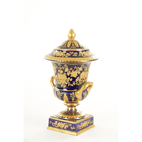 58 - A 19TH CENTURY CAMPANA SHAPED WEDGWOOD URN SHAPED VASE AND COVER of typical form, royal blue ground ... 