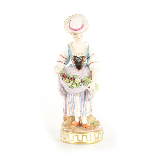 63 - A 19TH CENTURY MEISSEN FLOWER SELLER FIGURINE the colourful standing young lady displaying flower ga... 