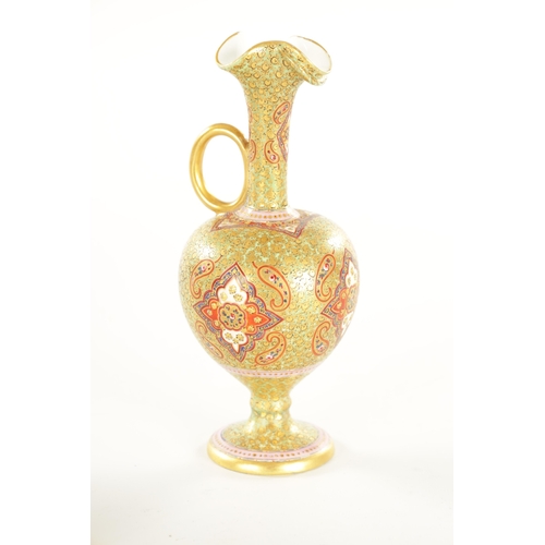 67 - A 19TH CENTURY PERSIAN STYLE CERAMIC EWER of footed bulbous form with triple pouring spout to the lo... 