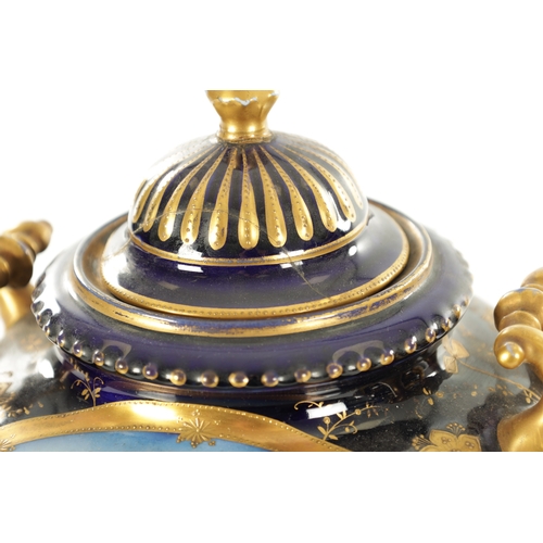 70 - A PAIR OF LATE 19TH CENTURY ROYAL BLUE AND GILT VIENNA STYLE LIDDED VASES the two-handled urn-shaped... 