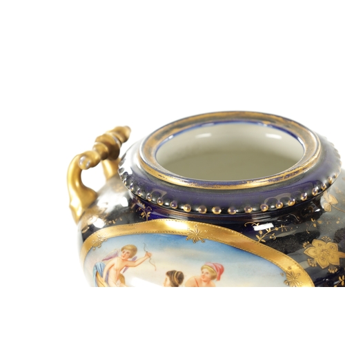 70 - A PAIR OF LATE 19TH CENTURY ROYAL BLUE AND GILT VIENNA STYLE LIDDED VASES the two-handled urn-shaped... 