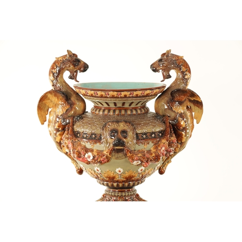 74 - A 19TH CENTURY CONTINENTAL MAJOLICA JARDINIERE ON STAND BY WILHELM SCHILLER & SONS, decorated with d... 