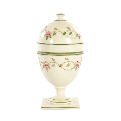 77 - AN EARLY 19TH CENTURY WEDGWOOD CREAMWARE EGG CUP AND COVER With rose pattern design on square base, ... 