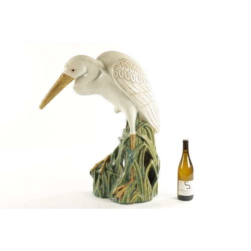 79 - A LARGE 19TH CENTURY MAJOLICA SCULPTURE OF A STORK (72cm high )