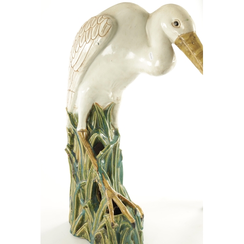79 - A LARGE 19TH CENTURY MAJOLICA SCULPTURE OF A STORK (72cm high )