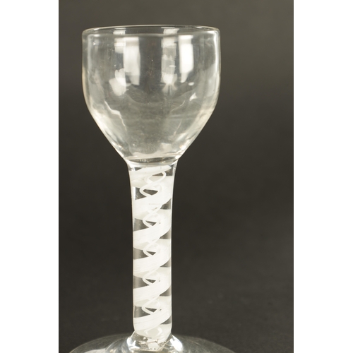 8 - AN 18TH CENTURY SHORT WINE GLASS the fluted ogee bowl on a centre double opaque cable twist and thre... 