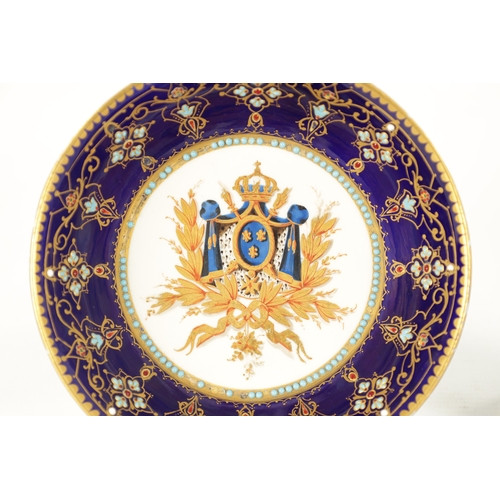 83 - A FINE 18TH CENTURY SEVRES GILT AND ROYAL BLUE GROUND PORTRAIT CUP AND SAUCER painted with a titled ... 