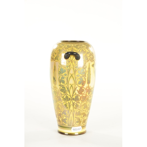 86 - AN EARLY 20TH CENTURY PILKINGTON'S ROYAL LANCASTRIAN LUSTRE TWIN HANDLED VASE BY JESSIE JONES of sli... 