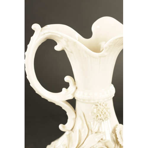 87 - A GOOD PAIR OF 19TH CENTURY BELLEEK, CO. FERMANAGH BLANC DI CHINE PORCELAIN EWERS the elegant ribbed... 