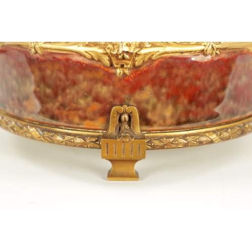 89 - LOUCHET A PARIS - A FRENCH ART NOUVEAU ORMOLU MOUNTED STONEWARE SHALLOW BOWL the high fired rouge mo... 