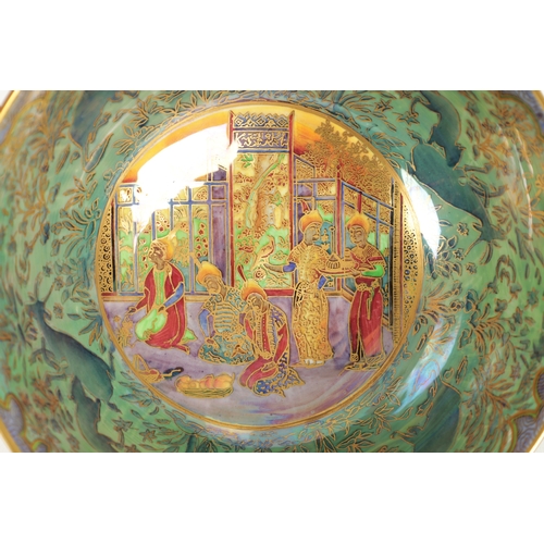 93 - AN EARLY 20TH CENTURY WEDGWOOD FAIRYLAND LUSTRE BOWL in the Nizami pattern designed by Daisy Makeig-... 