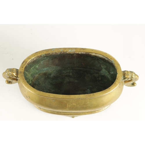 98 - AN EARLY GILT BRONZE CHINESE OVAL CENSER ON STAND with dog of foo side handles and shaped stand - bo... 