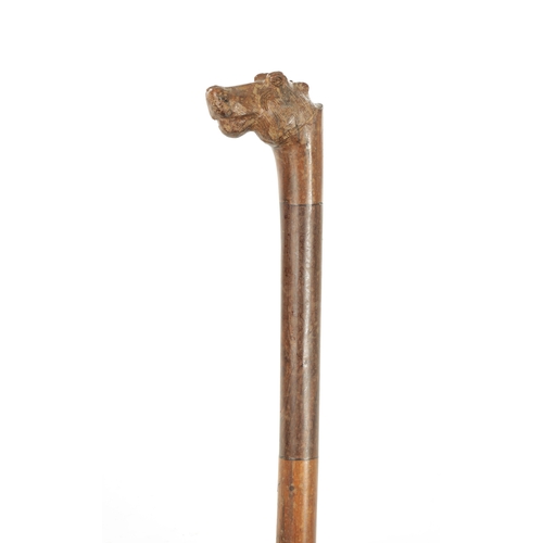 737 - A CARVED AFRICAN IRON WOOD WALKING STICK with carved Hippopotamus head handle (89cm overall)