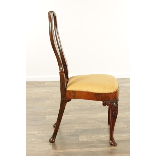 1404 - A QUEEN ANNE FIGURED WALNUT SIDE CHAIR with a solid vase-shaped splat, drop-in seat and raised on le... 