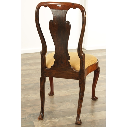 1404 - A QUEEN ANNE FIGURED WALNUT SIDE CHAIR with a solid vase-shaped splat, drop-in seat and raised on le... 