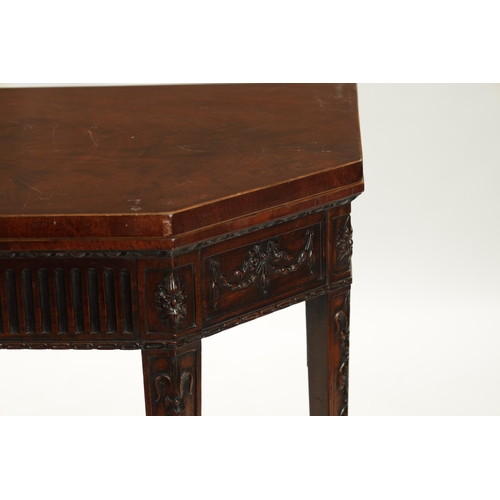 1406 - A LATE GEORGIAN ADAM-STYLE MAHOGANY CARD TABLE with ribbon and swag work carving (91cm wide 45cm dee... 