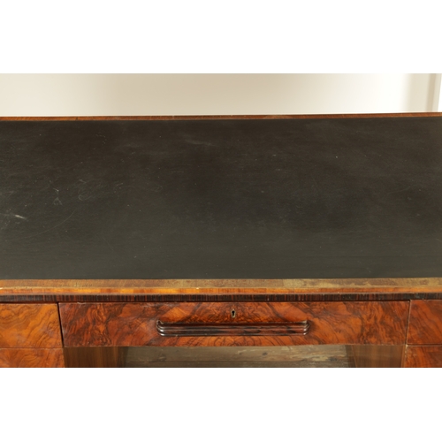 1411 - A STYLISH ART DECO WALNUT AND COROMANDEL PEDESTAL DESK with inset leather top having shaped corners ... 