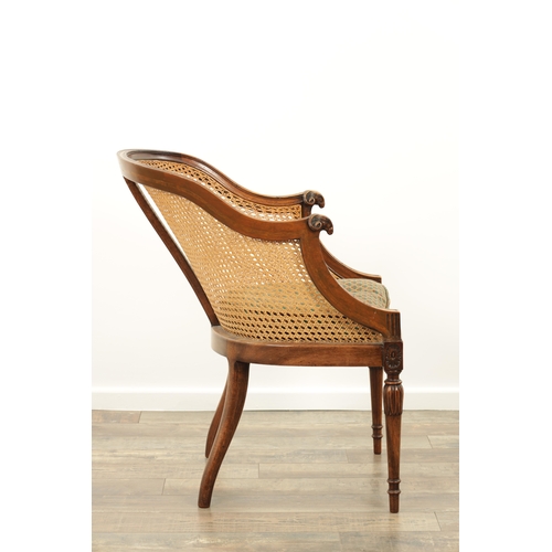 1413 - AN EARLY 20TH CENTURY ADAM STYLE MAHOGANY BERGERE CHAIR with rams head arms and leaf-carved decorati... 