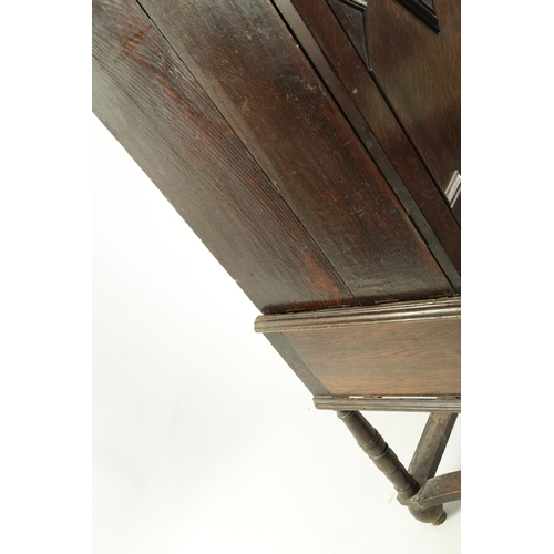 1414 - AN EARLY 18TH CENTURY OAK GEOMETRIC MOULDED CABINET ON STAND with cushion moulded cornice above a pa... 