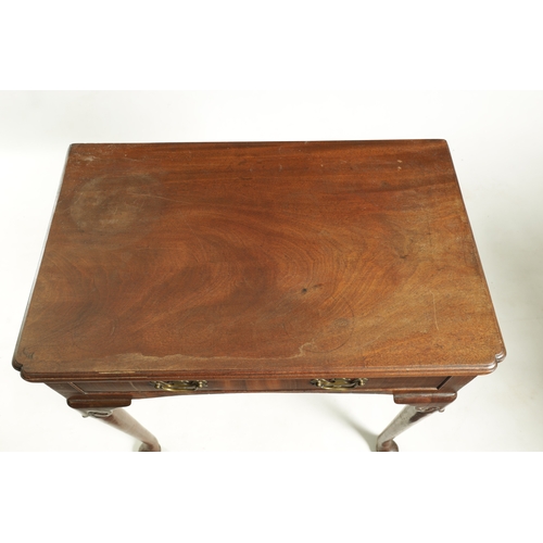 1419 - A GEORGE II FIGURED MAHOGANY SIDE TABLE the short grain frieze drawer fitted shaped brass handles an... 