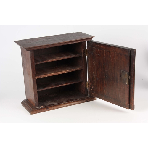 1422 - AN 18TH CENTURY OAK AND CROSSBANDED FIGURED WALNUT SPICE CABINET with hinged door enclosing a shelve... 