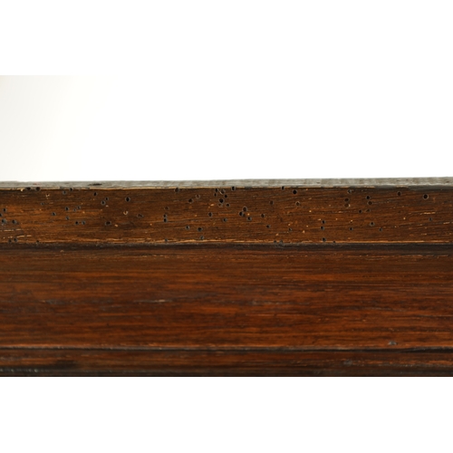 1424 - AN EARLY 18TH CENTURY OAK POSTED CANOPY DRESSER with shaped overhanging moulded top supported by rin... 