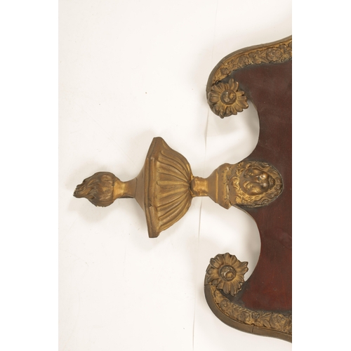 1428 - A GEORGE II MAHOGANY AND GILT GESSO HANGING MIRROR with a shaped swan-neck top and urn finial above ... 