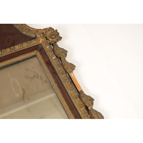 1428 - A GEORGE II MAHOGANY AND GILT GESSO HANGING MIRROR with a shaped swan-neck top and urn finial above ... 