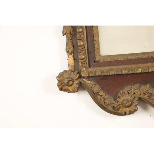 1428 - A GEORGE II MAHOGANY AND GILT GESSO HANGING MIRROR with a shaped swan-neck top and urn finial above ... 