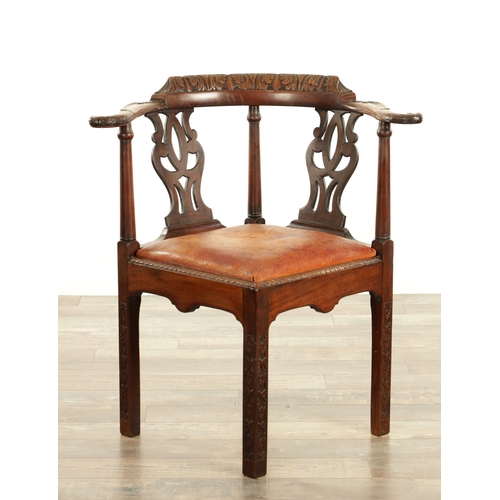 1529 - A GEORGE II MAHOGANY CHIPPENDALE STYLE CORNER CHAIR with leaf-carved top rail and eagle head arms ra... 