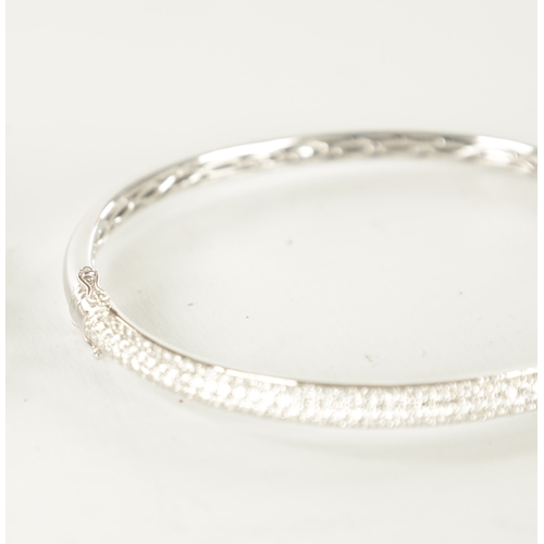 371 - AN 18CT WHITE GOLD AND DIAMON SET HINGED BANGLE 14.6g total weight (6.5cm wide)