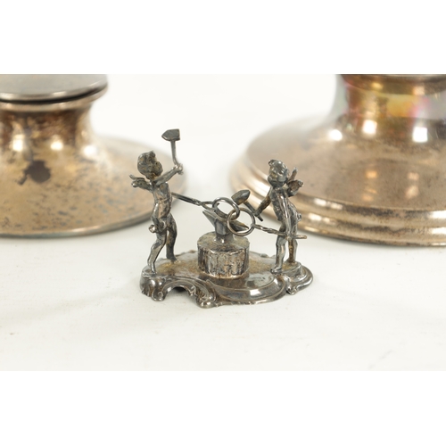 427 - A COLLECTION OF SILVER ITEMS comprising of two mugs, two ink wells and a cigarette case, 600 grams n... 