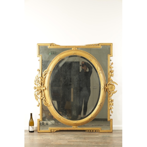 1415 - AN IMPRESSIVE 19TH CENTURY CARVED GILT WOOD OVER MANTEL MIRROR OF LARGE SIZE having an oval bevelled... 