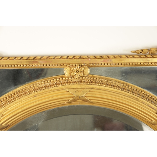 1415 - AN IMPRESSIVE 19TH CENTURY CARVED GILT WOOD OVER MANTEL MIRROR OF LARGE SIZE having an oval bevelled... 