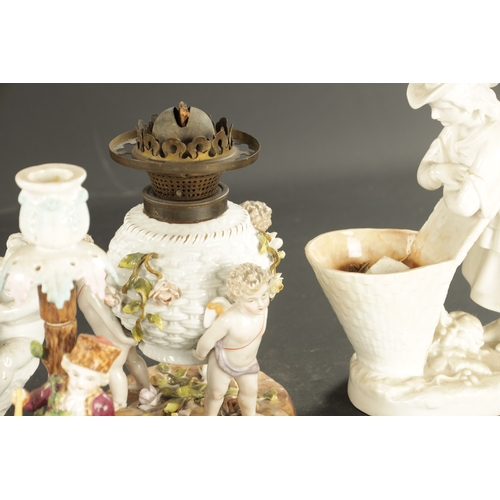 101 - A COLLECTION OF PORCELAIN comprising a pair of Sitzendorf candlesticks modelled as summer and winter... 