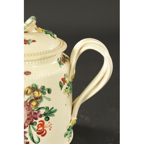 107 - AN EARLY 19TH CENTURY LEEDS CREAMWARE TEAPOT (18cm wide, 12cm high)