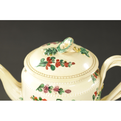 107 - AN EARLY 19TH CENTURY LEEDS CREAMWARE TEAPOT (18cm wide, 12cm high)