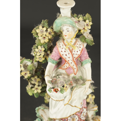 111 - TWO DERBY PORCELAIN FIGURES CIRCA 1765 one of a man with a basket gathering fruit and a girl gatheri... 