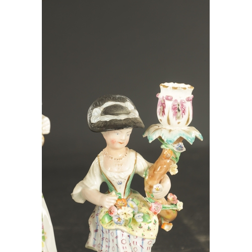 115 - A CHELSEA/DERBY PORCELAIN FIGURE OF A FRUIT SELLER CIRCA 1770, along with A DERBY PORCELAIN CANDLEST... 