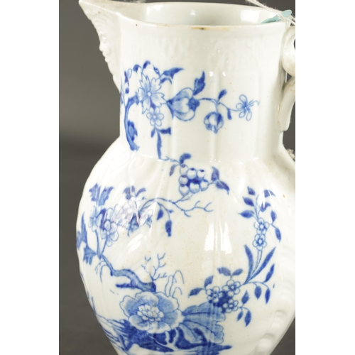 145 - A LATE 18TH CENTURY CAUGHLEY PORCELAIN JUG PAINTED WITH FLOWERING PLANTS (21cm high)