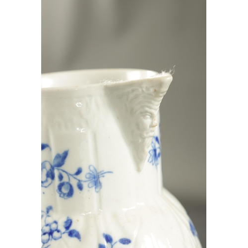 145 - A LATE 18TH CENTURY CAUGHLEY PORCELAIN JUG PAINTED WITH FLOWERING PLANTS (21cm high)