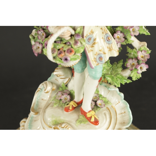 148 - A FRENCH PORCELAIN LAMP FIGURE of a boy with a basket of fruit in the derby style (36cm High)