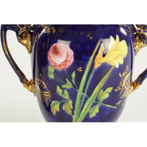 149 - A SPODE PORCELAIN VASE PAINTED WITH FLOWERS ON A COBALT GROUND (21cm high)