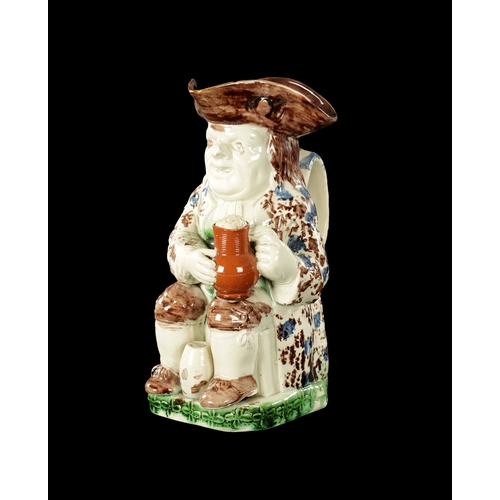 155 - A LATE 18TH CENTURY RALPH WOOD STYLE TOBY JUG with petal base decoration (25cm high)