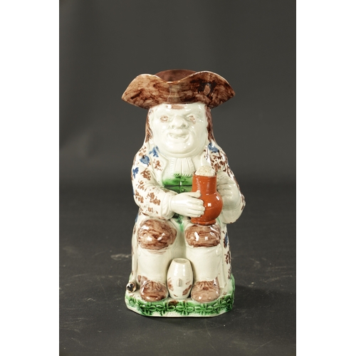 155 - A LATE 18TH CENTURY RALPH WOOD STYLE TOBY JUG with petal base decoration (25cm high)