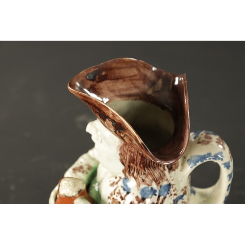 155 - A LATE 18TH CENTURY RALPH WOOD STYLE TOBY JUG with petal base decoration (25cm high)