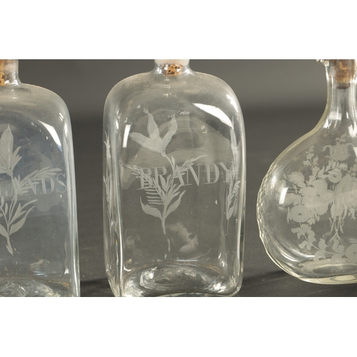 17 - A PAIR OF GEORGIAN RECTANGULAR SPIRIT DECANTERS with engraved labels and flower sprays, and a set of... 